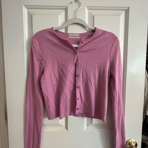 Urban Outfitters pink cropped cardigan.